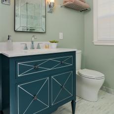 Elegant Bathroom With Freestanding Navy Blue Vanity