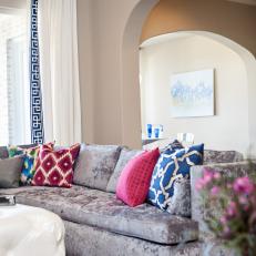 Gray Sofa With Pink and Blue Pillows