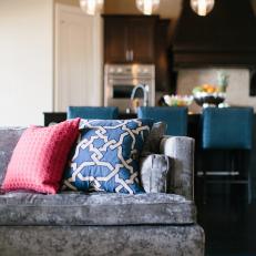 Gray Sofa With Pink and Blue Pillows