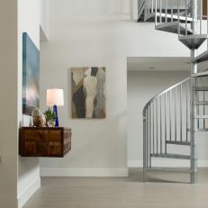 Metallic Spiral Stairs in Modern Foyer