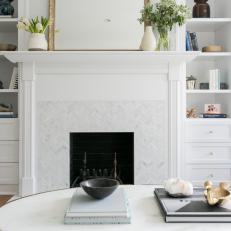 Detail of Built-In Bookshelves and Marble Fireplace Surround