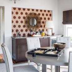 Silver Dining Table, Nailhead Trimmed Chairs and Hexagon Pattern Accent Wall in Midcentury Modern Dining Room 