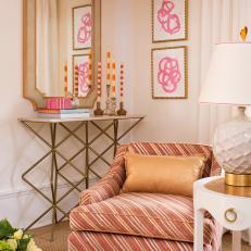 Stylish Neutral Sitting Space With Striped Armchair, Hot Pink Details and Gold Base Contemporary Table