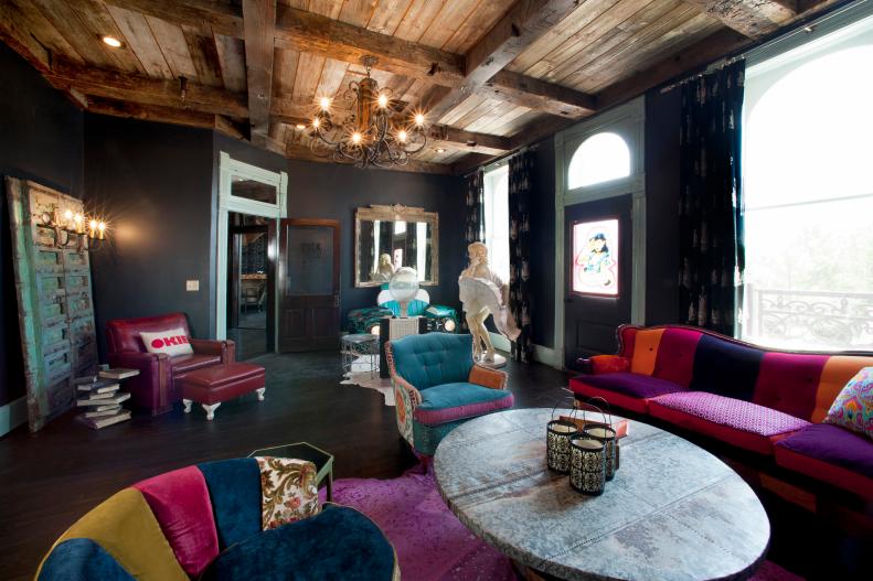 Black Eclectic Sitting Area With Colorful Furniture & Wood Coffered Ceiling