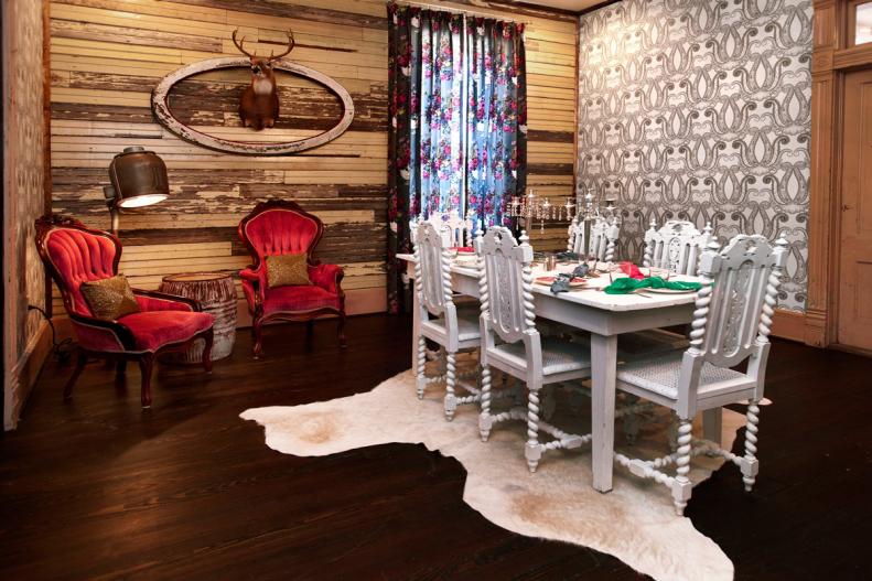 Eclectic Dining Room With Animal Hide Rug, Red Velvet Chairs & Dark Wood Floor