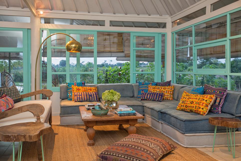 Tropical Sunroom With Colorful Pillows, Sectional & Aqua Windows Panes