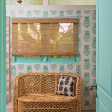 Sitting Room With Rattan Loveseat & Pineapple Wallpaper