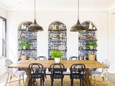 Chic Dining Room With Trio of Arched Niches