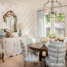 Shabby Chic Dining Room With Stripe Slip Cover Chairs, Distressed Wood Cabinet and White Hydrangea Centerpiece 