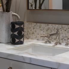 Mosaic Tile Backsplash, Marble Countertop Offer Complementary Look