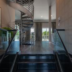 Industrial Front Entryway With Spiral Stairs