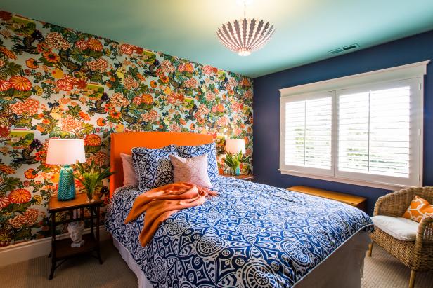 Contemporary Bedroom With Multicolor Floral Wall & Orange Accents