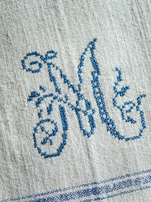 Step 4: Knot Thread in BackOnce thread is too small to work with, double knot it on backside of linen towel and trim.  Use a new piece of two-ply floss and continue working on pattern until it is complete.