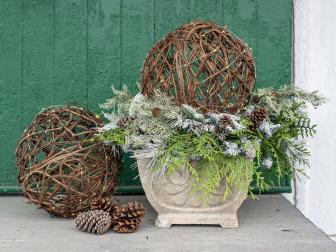For simple, but high impact arrangement for a porch or entryway, try these lighted grapevine spheres.  They are a great way to fill urns that have been left empty once the summer and fall flowers fade.