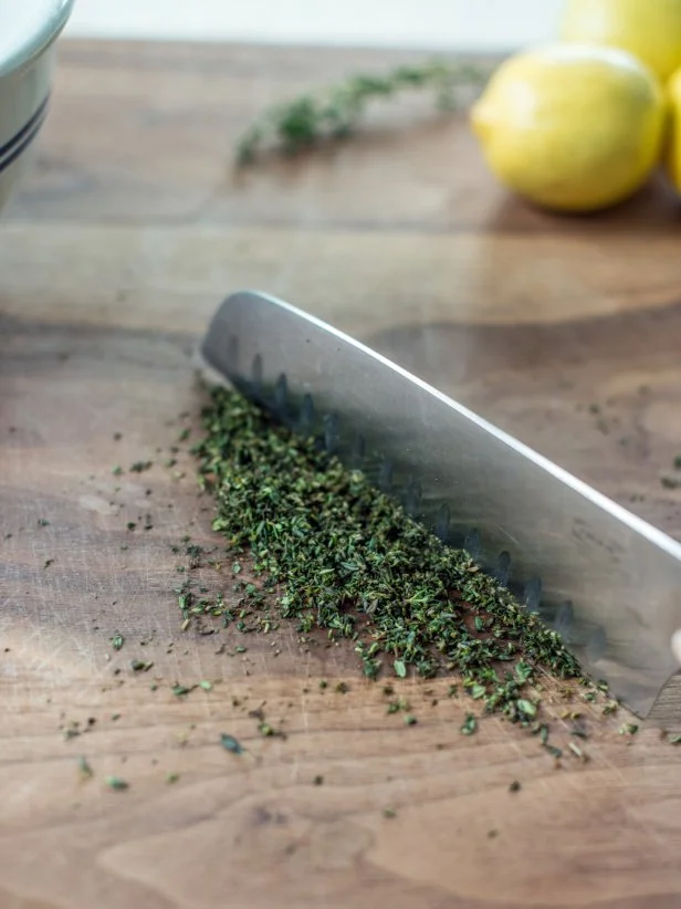Step 1:Strip and Finely Chop Thyme LeavesUsing your fingers, strip fresh thyme leaves off stem.  Finely chop with a chefâs knife.  Drop in small mixing bowl and set aside.