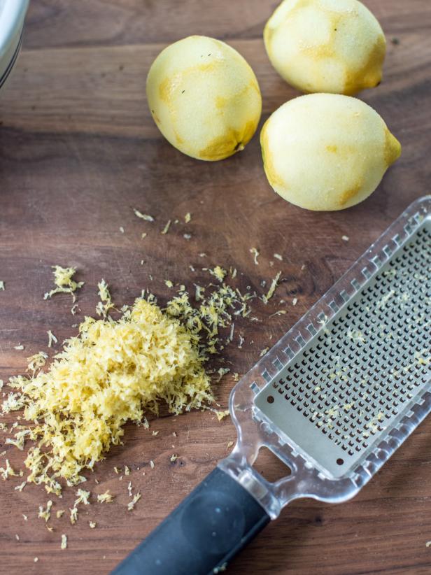 Step 2: Zest LemonsRun lemons along a microplane zester to remove zest from lemon peel.  Only plane off the yellow part of the peel, because the rind becomes bitter where it turns white.  Add lemon zest to thyme in mixing bowl.