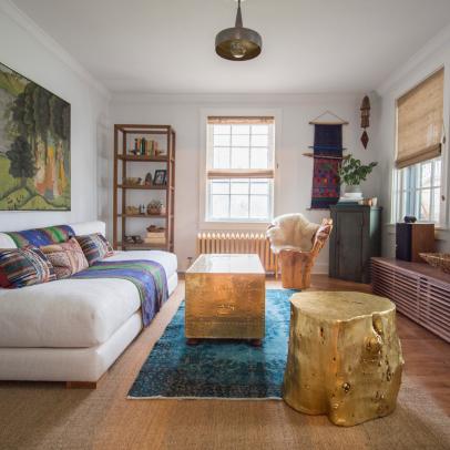 Eclectic Living Room With Low Level Furniture, Arm-Free White Sofa, and Gold Wood Stump Stool 
