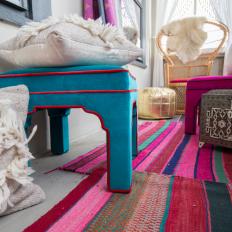 Vibrant, Colorful Porch Details Featuring Upholstered Stools, Striped Multicolor Rug and Metallic Floor Cushion 