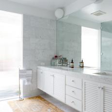 Bright Main Bathroom With White Marble Wall, Floor and Countertop, Yellow Runner and Long Double Vanity 