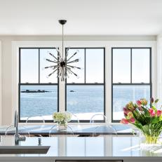 Black Frame Windows In Open Dining Room And Kitchen