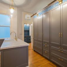 Luxe Gray Kitchen With Brass Cabinet Handles
