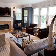 Navy Blue Family Room With Fireplace and Animal Horns
