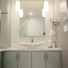 Elegant Contemporary Bathroom With White Vessel Sink, Pendant Lighting and Tile Pattern Backsplash 