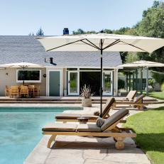 Serene Backyard Pool Escape With Teak Lounge Chairs