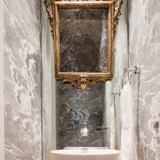 Cloud-Filled Powder Room With Gold Frame