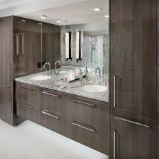 Contemporary Bathroom Double SInk Vanity With Marble Countertop Framed By Woodgrain Cabinetry 