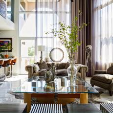 Double Story, Open Contemporary Living Room with Traditional Armchairs and Asian Wood Floor Stools 