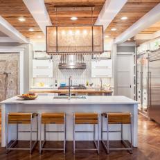 Contemporary Kitchen With Chevron Hardwood Floor, White Ceiling Beams and Island Dine-In Set Up 
