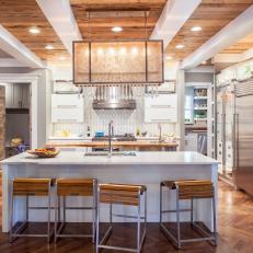 Inviting Contemporary Kitchen With Hardwood Decorative Finishes, Crystal Fringed Chandelier And Island Dining 