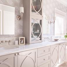 Light Contemporary Bathroom Vanity With Decorative Cabinet Doors, Neutral Wallpaper and Marble Countertop 
