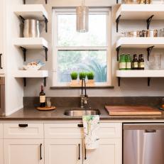 Transitional Kitchen Sink With Brown Countertop and Stacked White Mounted Shelves for Open Storage  