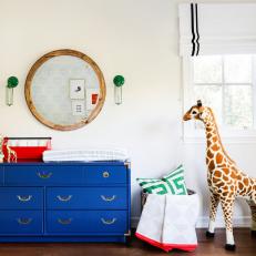 Bright Blue Changing Table in Boy's Nursery
