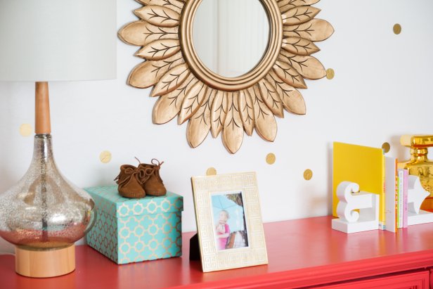Contemporary Girl's Nursery With Gold Mirror