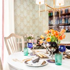 Bold Colors and Patterns and Gold Accents Give Cottage Dining Room a Bright New Makeover