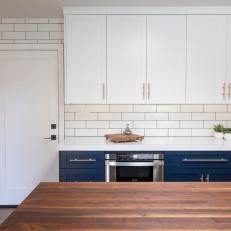 Navy Cabinets in All-White Kitchen