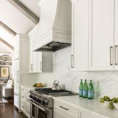 White Cottage Kitchen With Marble Backsplash