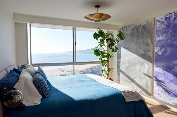 Oceanfront, White Modern Bedroom With Blue Bedding & Houseplant
