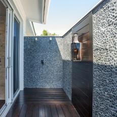 Outdoor Shower With Pebble Stone Walls