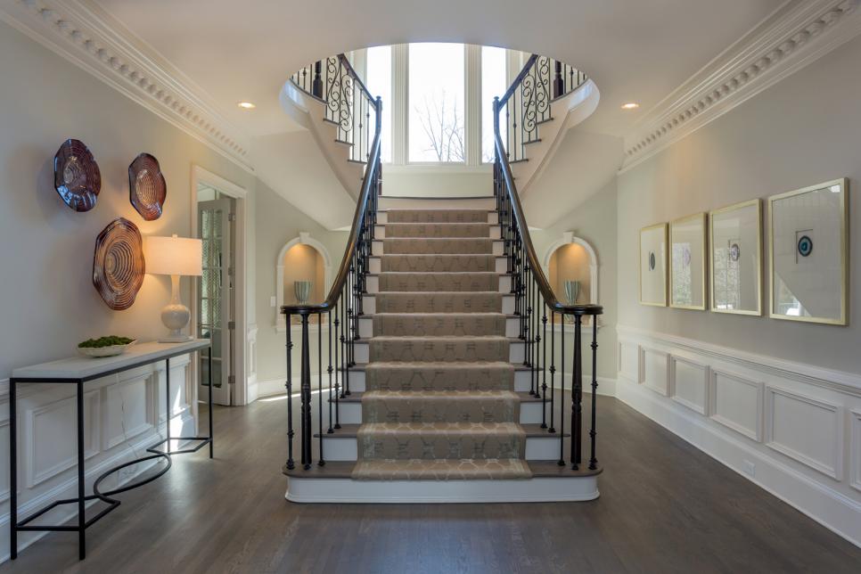 Gray Transitional Entry With White Chair Rail, Trim & Staircase