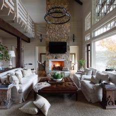 Neutral Rustic Family Room With Stone Chimney