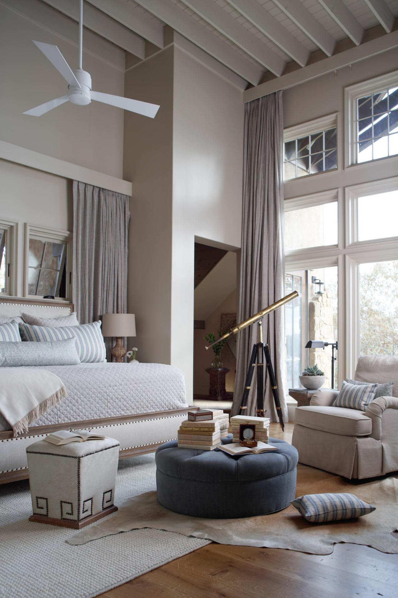 Neutral Transitional Master Bedroom With Round Ottoman Hgtv