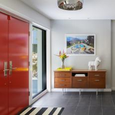 Midcentury Entry With Striped Rug and Console Table