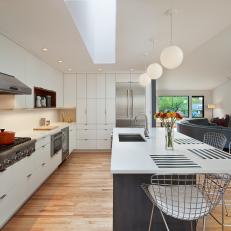 Stylish, Midcentury Modern Kitchen With Bertoia Barstools