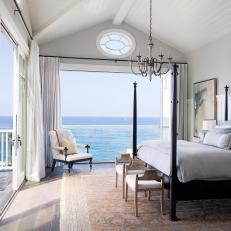 Poster Bed and Chandelier in Master Bedroom With Ocean View