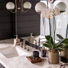 Globe Light Fixture and Flower on Marble Topped Vanity