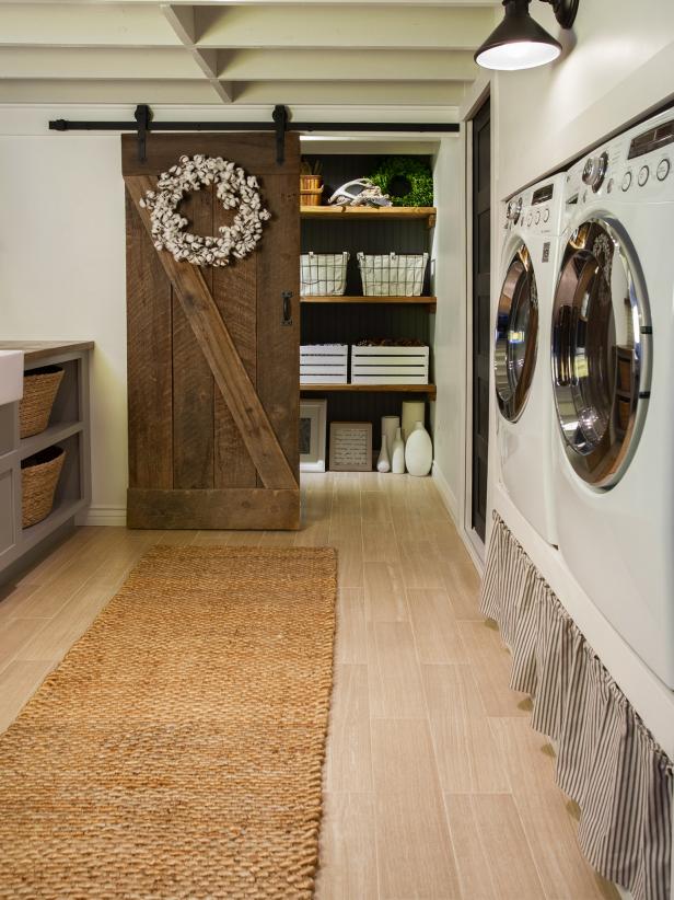 With the washer and dryer elevated in her new laundry room, Jenna Sue of Jenna Sue Design Co. found herself with some welcome extra storage space. She opted to use fabric in place of drawers to add a less expensive, custom touch. â  The curtain is great for hiding detergents and laundry supplies,â   she says. â  Itâ  s such a simple solution and softens the hard lines while emphasizing farmhouse style.â  
Even if you donâ  t have under-machine storage, we love this idea for other spaces, too. Stapled or Velcro-ed beneath a shelf or cabinet or in a nook with a tension rod, skirted storage is a simple, pretty storage solution.